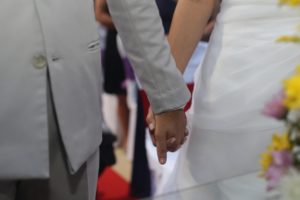 Married couple holding hands