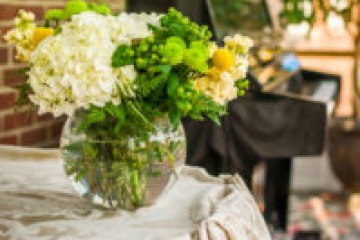 Flowers before a piano in the Atrium
