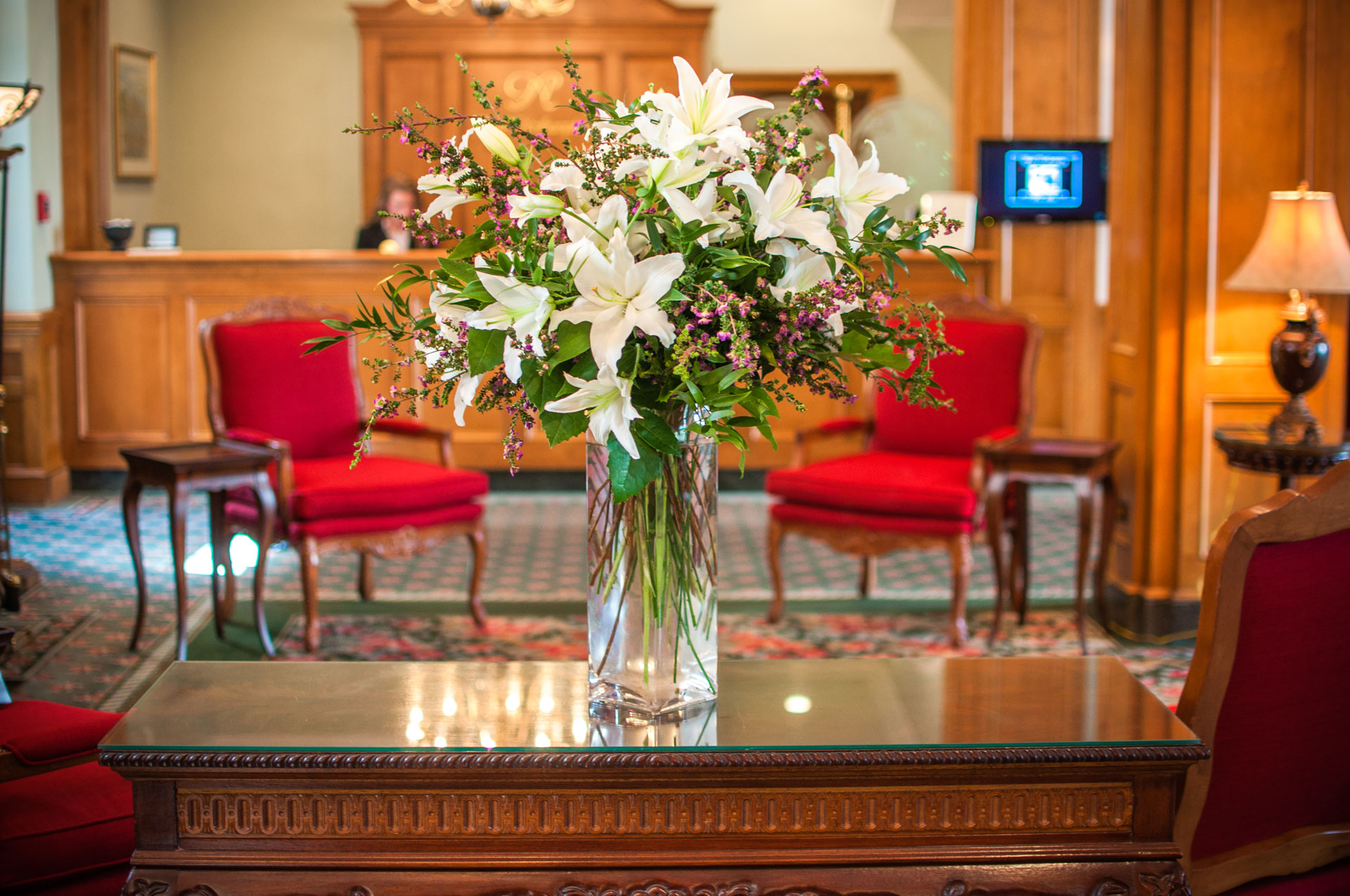 Flowers before the front desk in the Foyer