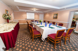 executive boardroom overview, long table and projector