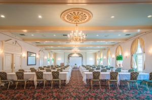 grand ballroom overview, chandeliers and long tables