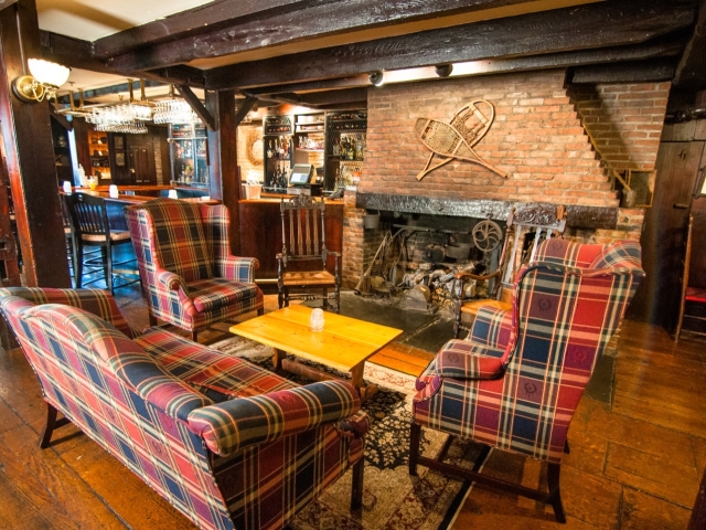 Wiggins Tavern sitting area in front of fireplace